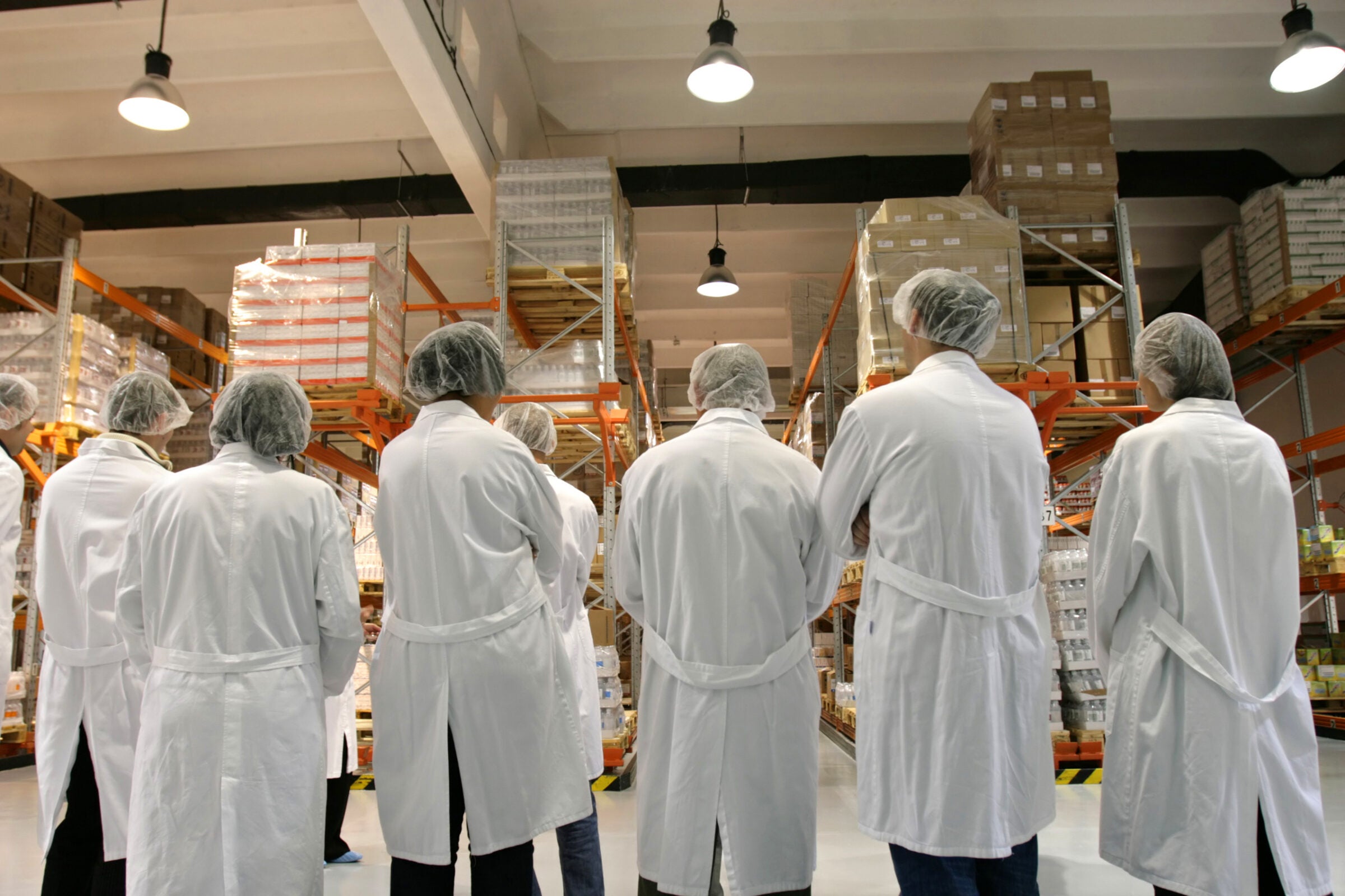 Healthcare workers in pharmaceutical warehouse